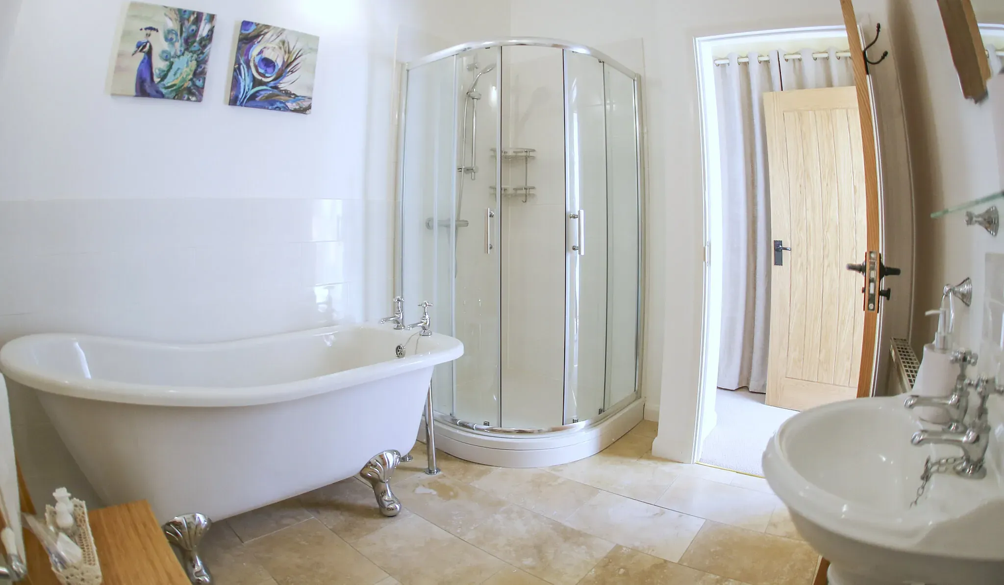 Chestnut Barn ensuite with a roll-top slipper bath and a corner shower